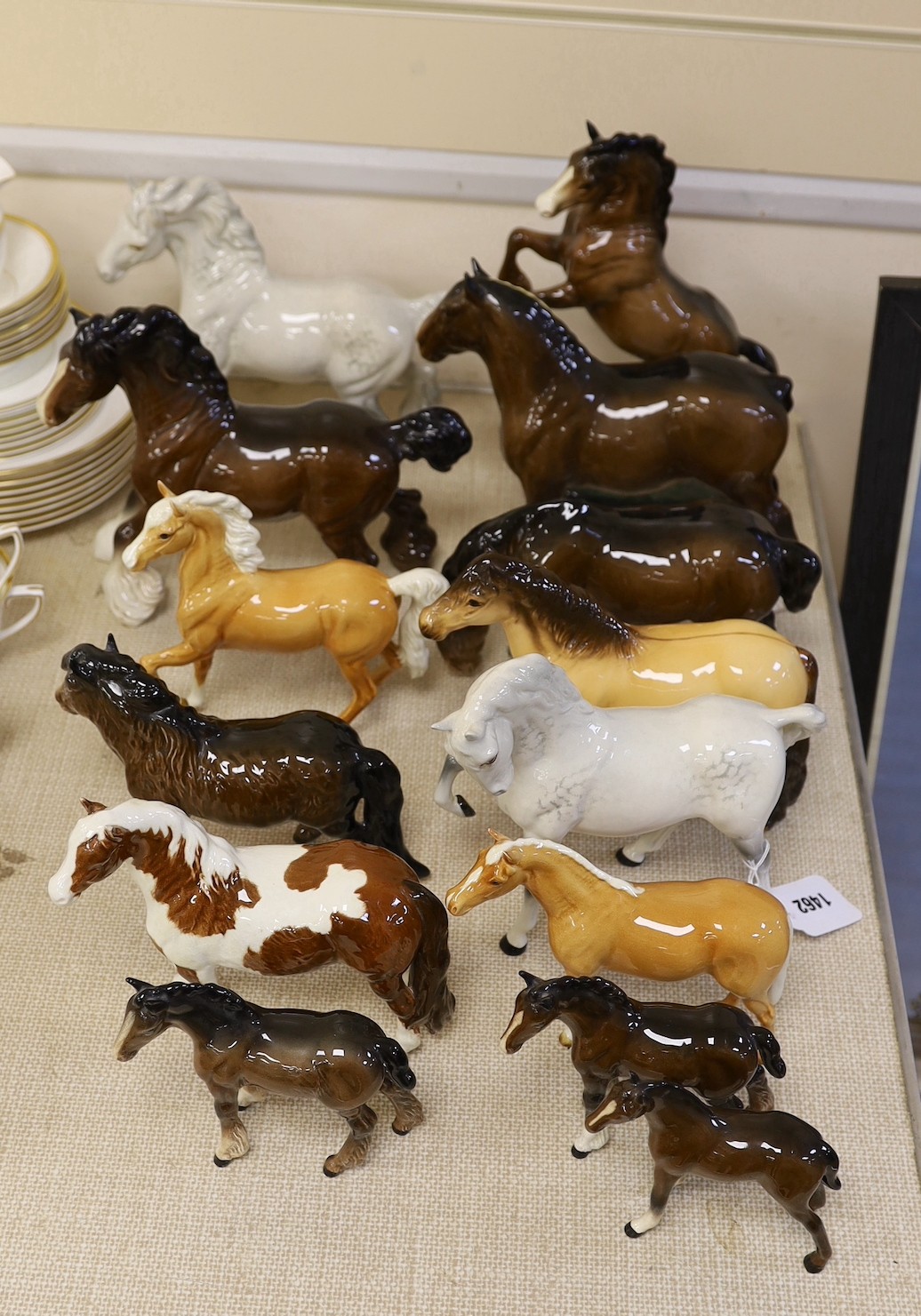 A selection of Beswick horses, to include Highland, Shire, Palomino and others (14)